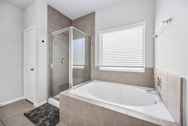 bathroom featuring tile patterned floors and plus walk in shower