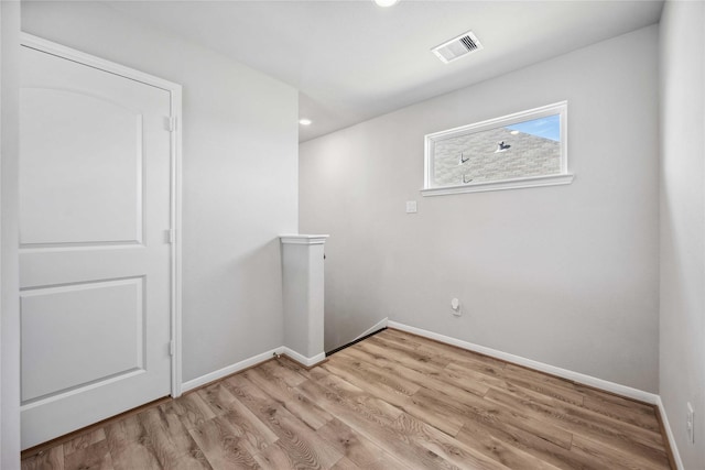 unfurnished room featuring light wood-type flooring