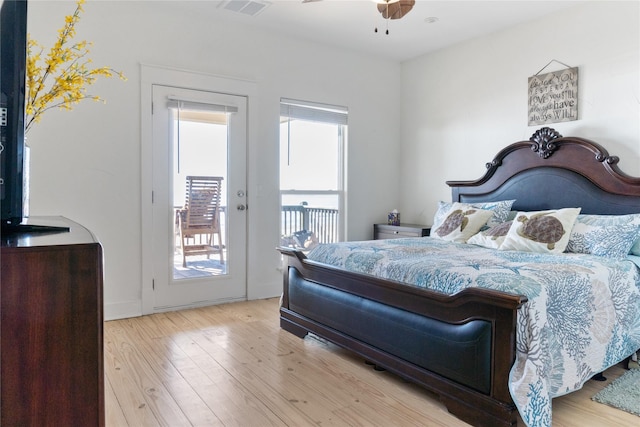 bedroom featuring access to outside and light hardwood / wood-style floors