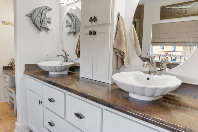 bathroom featuring vanity and wood-type flooring