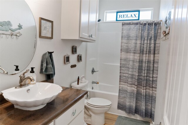 full bathroom featuring vanity, toilet, and shower / tub combo