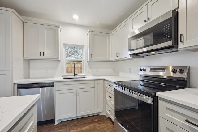 kitchen featuring white cabinetry, appliances with stainless steel finishes, and sink