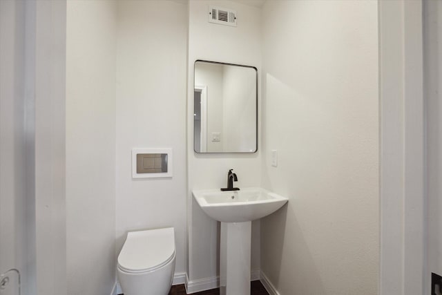 bathroom with toilet and sink