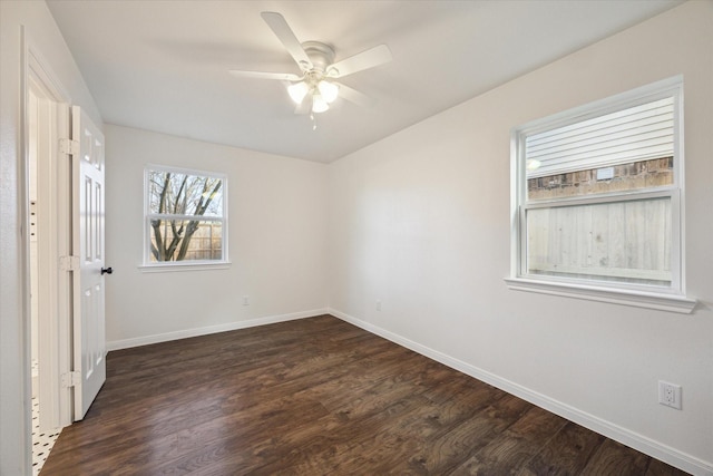 unfurnished room with dark hardwood / wood-style floors and ceiling fan