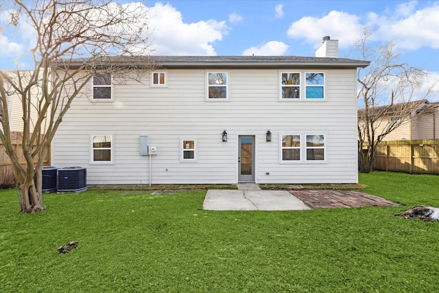 back of house featuring a yard, a patio, and central air condition unit