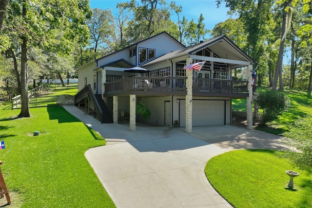 coastal inspired home with a wooden deck, a garage, and a front yard