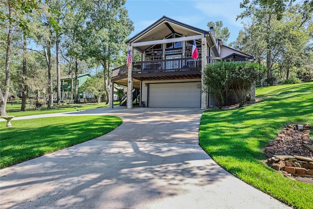 view of front facade with a garage and a front lawn