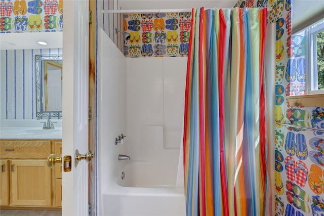 bathroom with vanity and shower / tub combo with curtain