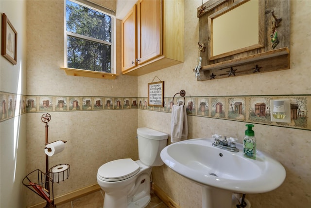 bathroom featuring sink and toilet