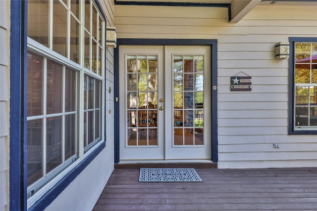 view of exterior entry featuring french doors