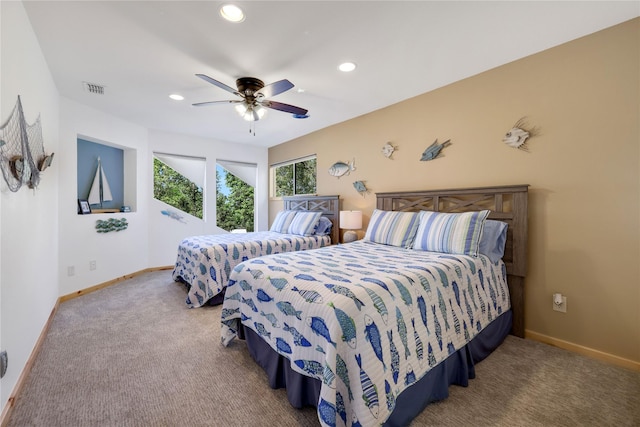 carpeted bedroom with ceiling fan