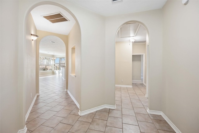 hallway with light tile patterned flooring