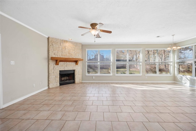 unfurnished living room with crown molding, ceiling fan with notable chandelier, a textured ceiling, and a fireplace