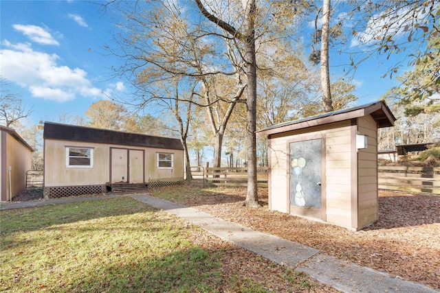 view of outbuilding with a yard