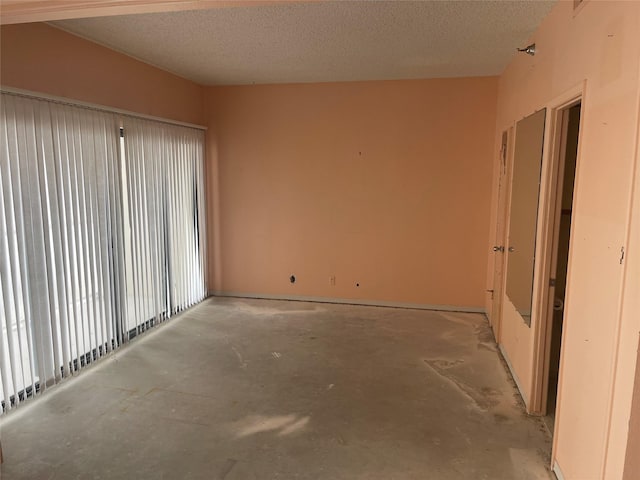 spare room featuring a textured ceiling