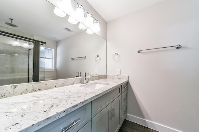 bathroom featuring vanity and walk in shower