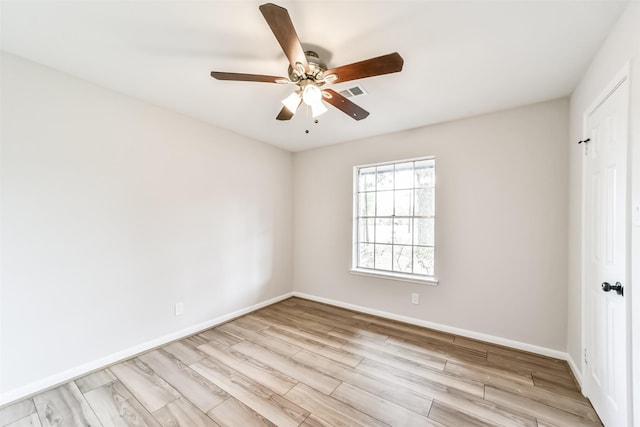 unfurnished room with ceiling fan and light hardwood / wood-style flooring