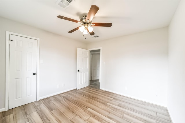 unfurnished bedroom featuring ceiling fan and light hardwood / wood-style flooring