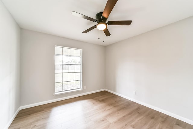 empty room with light hardwood / wood-style floors and ceiling fan