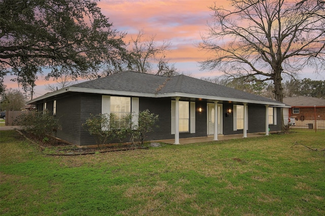 view of front of property with a lawn