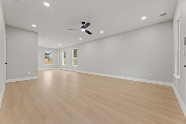 unfurnished living room with ceiling fan and light wood-type flooring