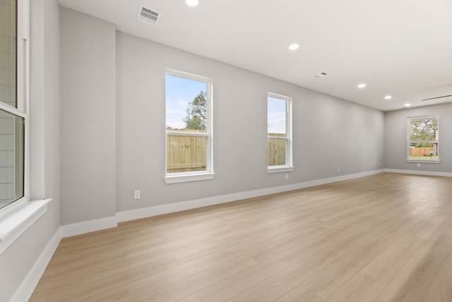 spare room featuring light wood-type flooring