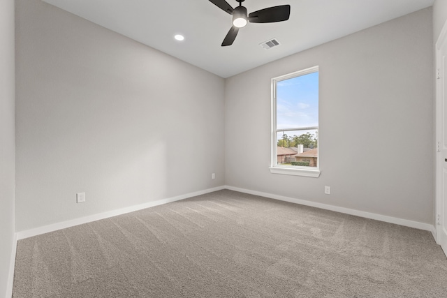 spare room featuring ceiling fan and carpet flooring