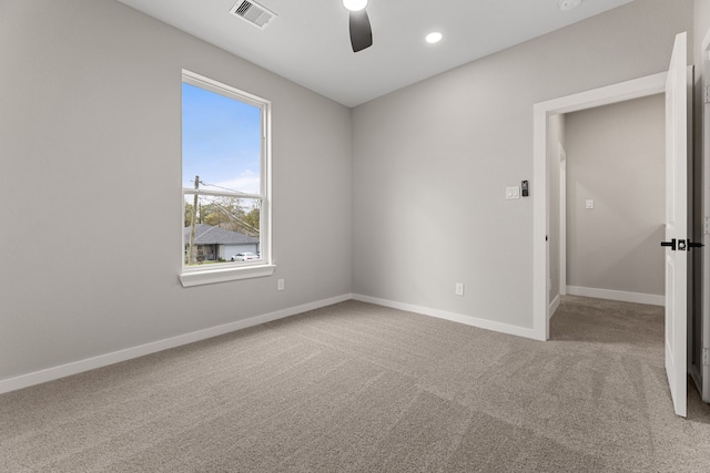 spare room with ceiling fan and carpet flooring