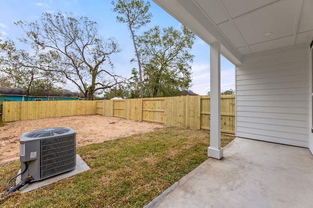 view of yard with cooling unit and a patio area