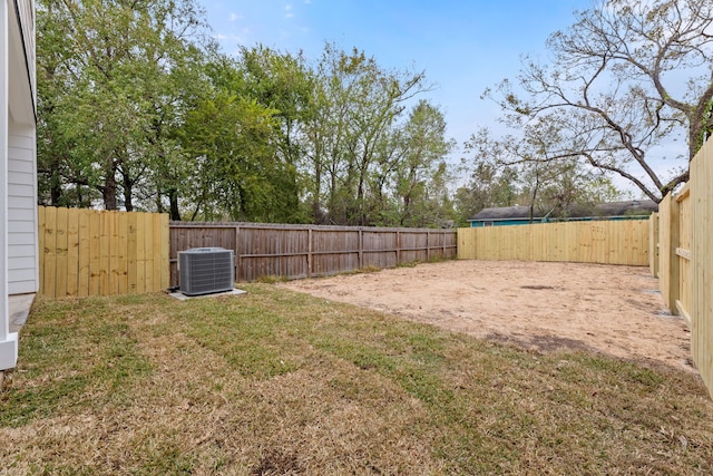 view of yard featuring central air condition unit