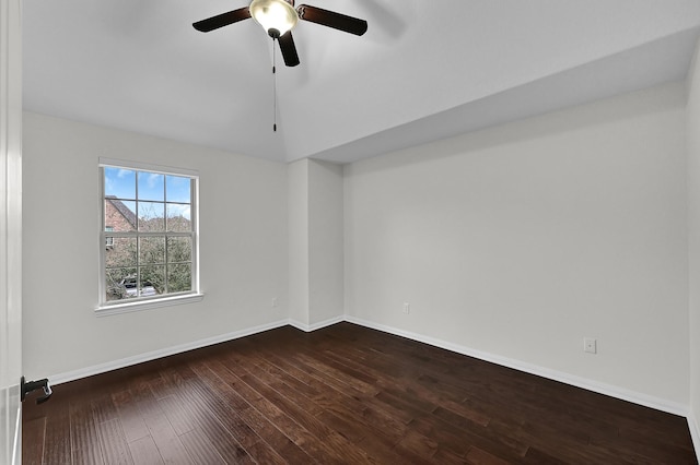 empty room featuring lofted ceiling, wood-type flooring, and ceiling fan