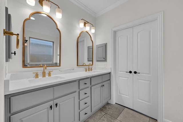 bathroom featuring vanity, tile patterned floors, and ornamental molding