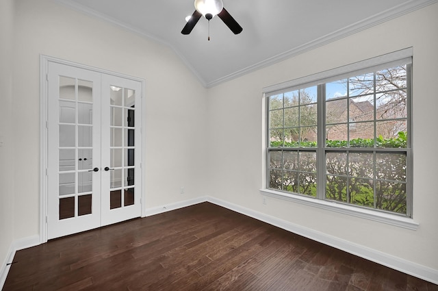 spare room featuring lofted ceiling, ornamental molding, french doors, and a healthy amount of sunlight