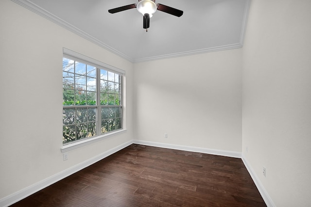 empty room with ornamental molding, ceiling fan, and dark hardwood / wood-style flooring