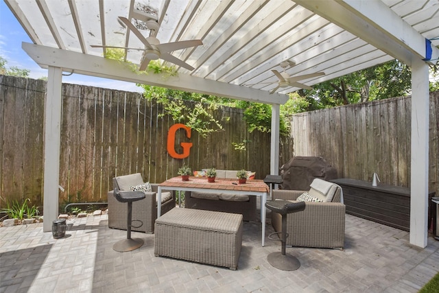 view of patio / terrace featuring a fenced backyard, a ceiling fan, outdoor dining area, and a pergola