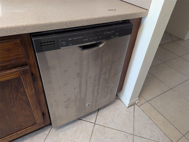 interior details with dark brown cabinetry and dishwasher