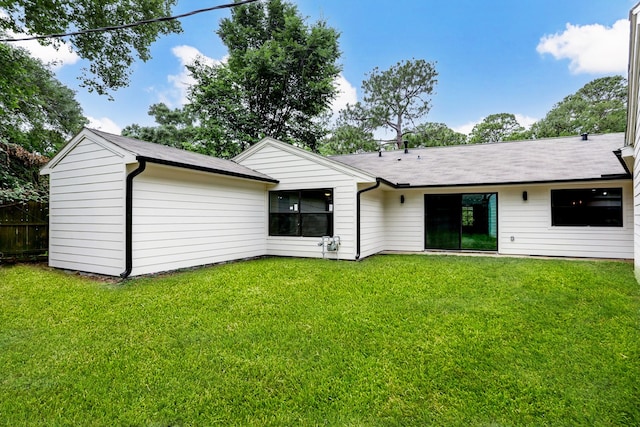 back of house with a yard