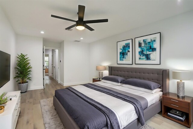 bedroom featuring ceiling fan and light hardwood / wood-style flooring