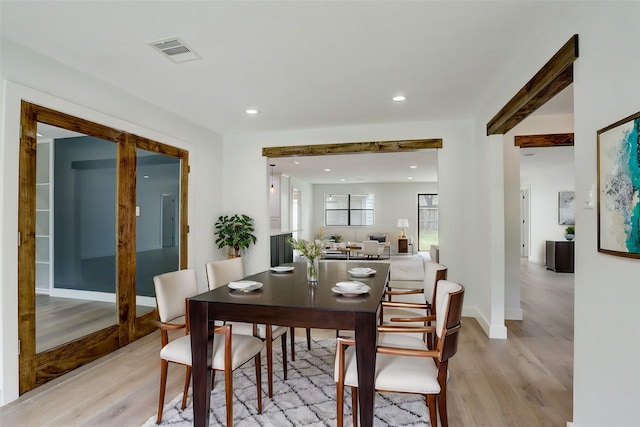 dining room with light hardwood / wood-style flooring