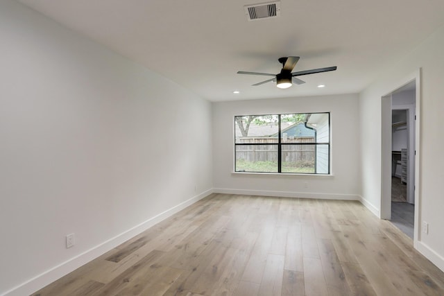 unfurnished room featuring ceiling fan and light hardwood / wood-style flooring