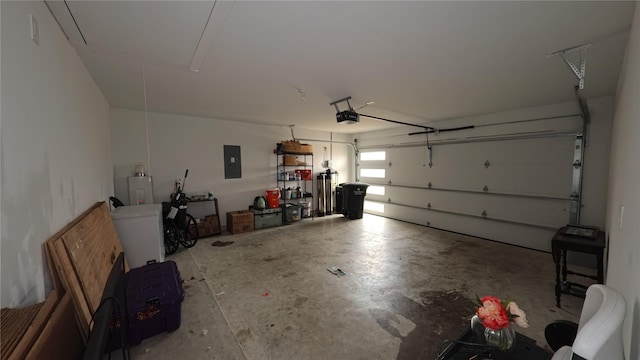 garage featuring a garage door opener and electric panel