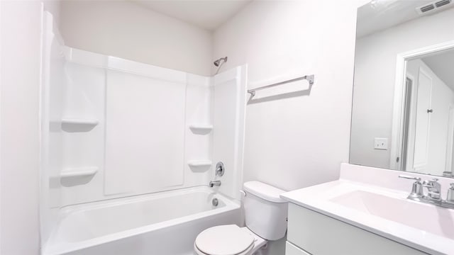 full bathroom with vanity, toilet, and  shower combination