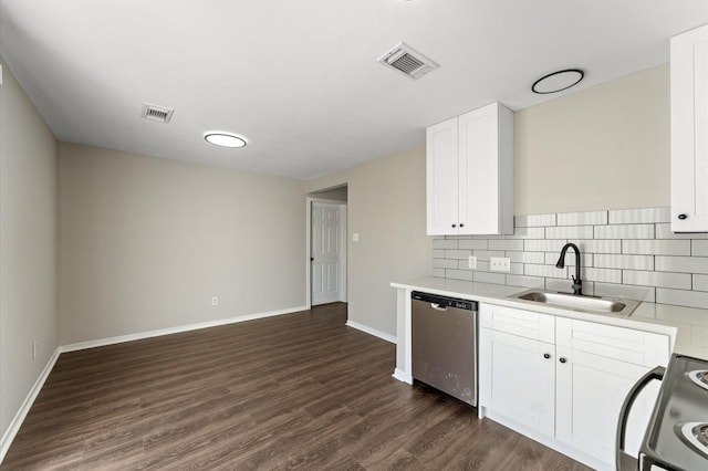 kitchen with tasteful backsplash, sink, white cabinets, stove, and stainless steel dishwasher