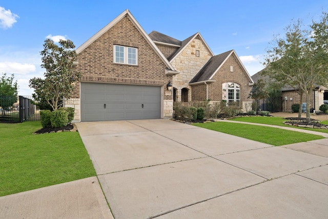 view of front of home featuring a garage and a front lawn