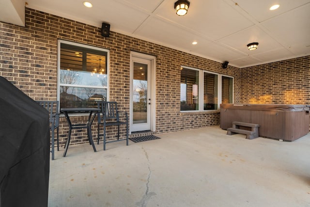 view of patio / terrace featuring a hot tub