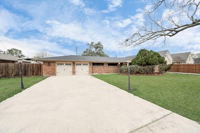 ranch-style house with a garage and a front yard