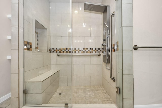 bathroom with a shower with shower door