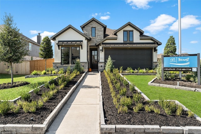 view of front facade featuring a standing seam roof, stone siding, fence, a front yard, and metal roof