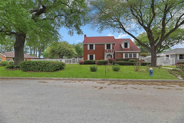 view of front of property with brick siding and a chimney