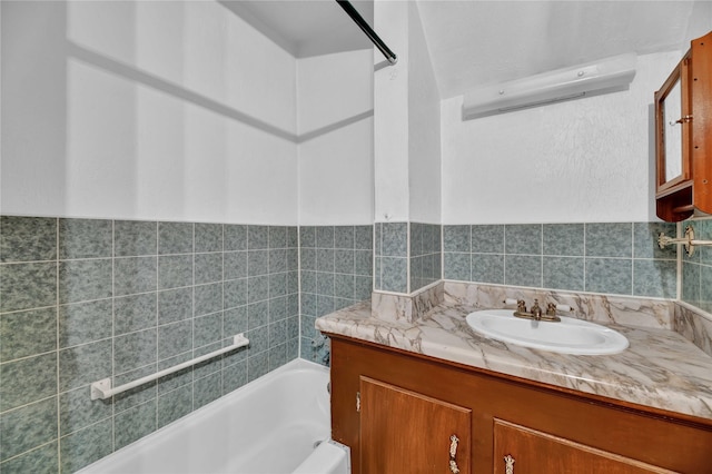 bathroom featuring a tub to relax in and vanity